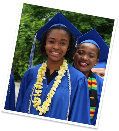 Two black female students in graduation robes and caps